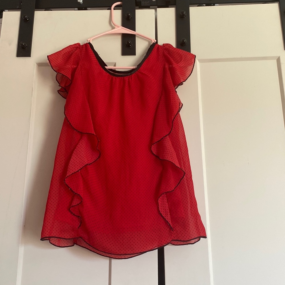 A red with black dot shirt very cute